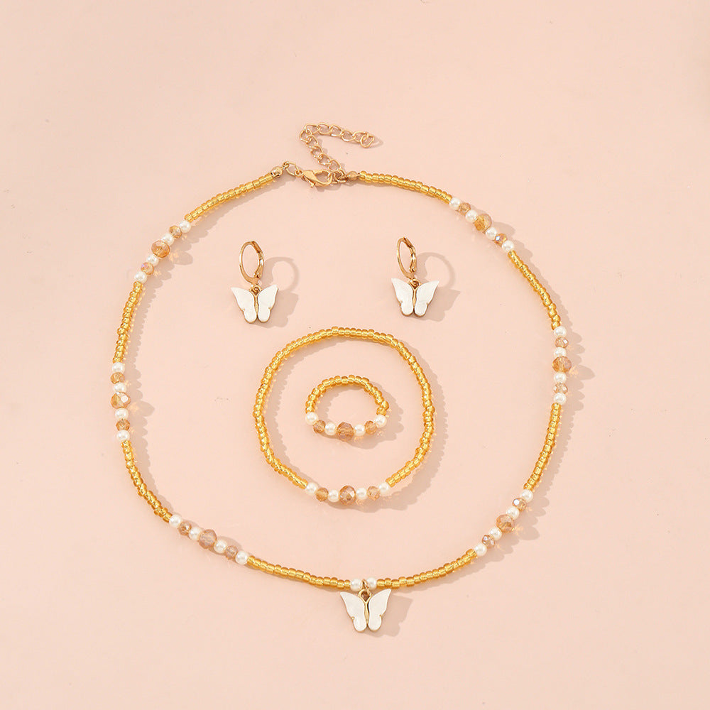 Set Collana Minimalista con Ciondoli a Farfalla e Cuore Smaltati per Bambini, Bracciale e Anello con Perline di Vetro, Catena a Sfere