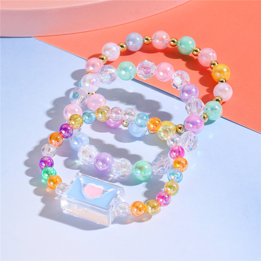 Juego de pulseras de resina con cuentas en forma de corazón estilo caricatura con dijes de cola de sirena y conchas marinas para niños