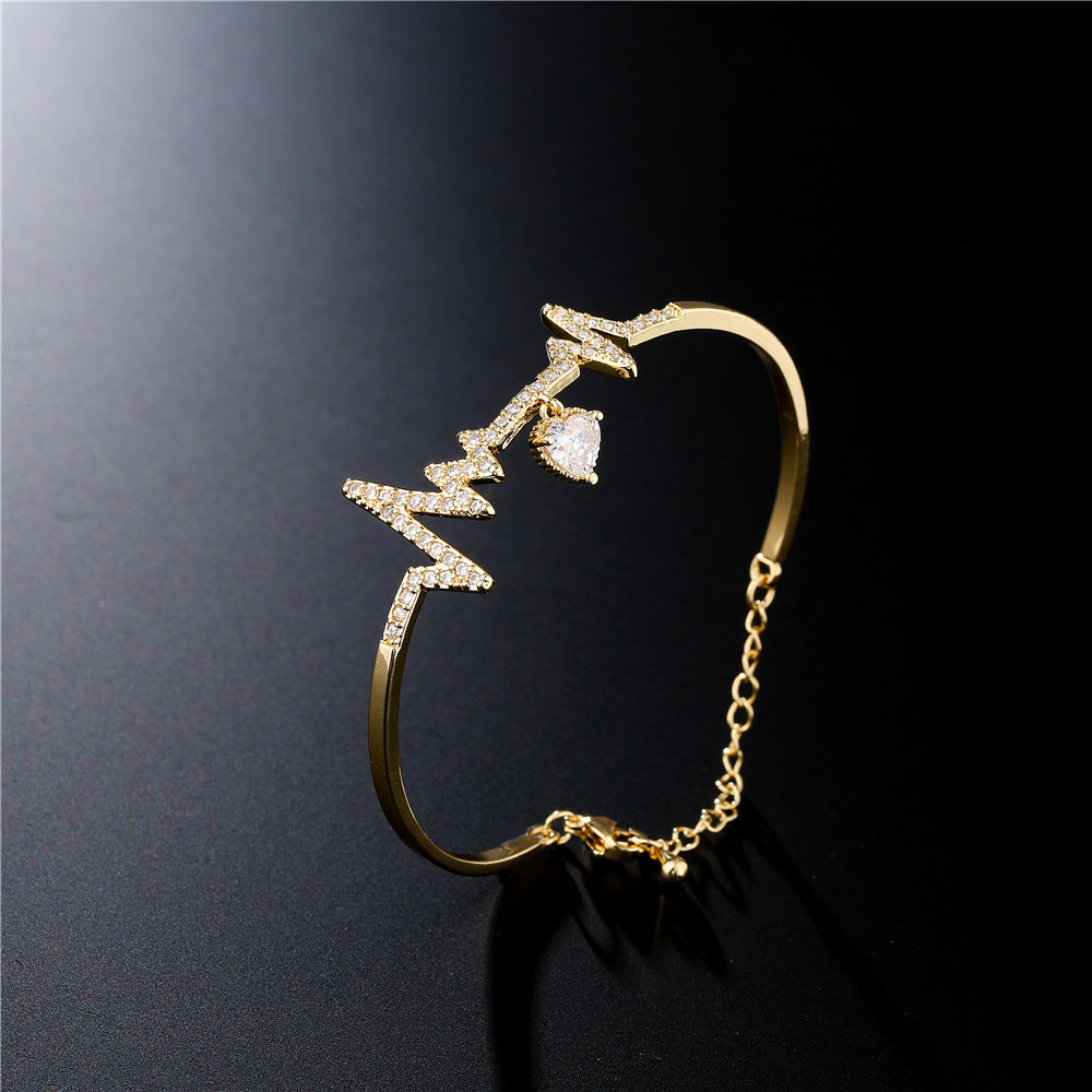 Gold Plated Brass Heartbeat Bracelet with Cubic Zirconia Inlay