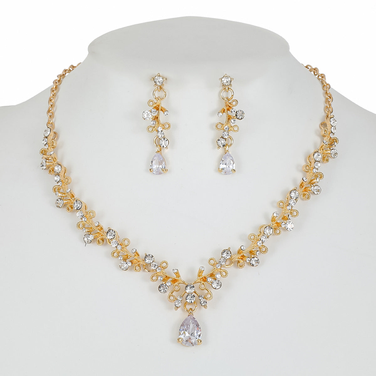 Set di collana e orecchini in lega dolce e fresca con ciondolo in cristallo a forma di campana a goccia a cuore, finitura placcata per donna