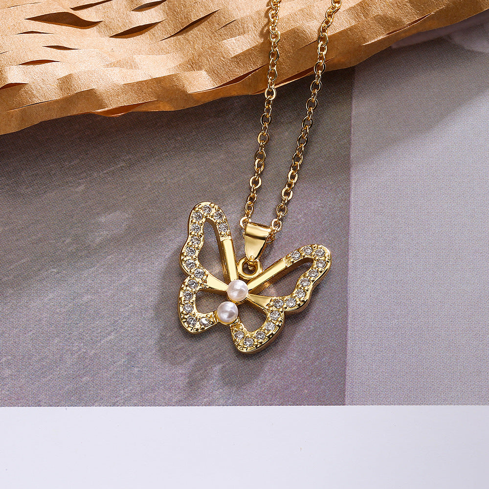 Collana Minimalista con Ciondolo Farfalla e Stella da Donna con Base in Rame Placcata in Oro Vero e Intarsi in Zirconi