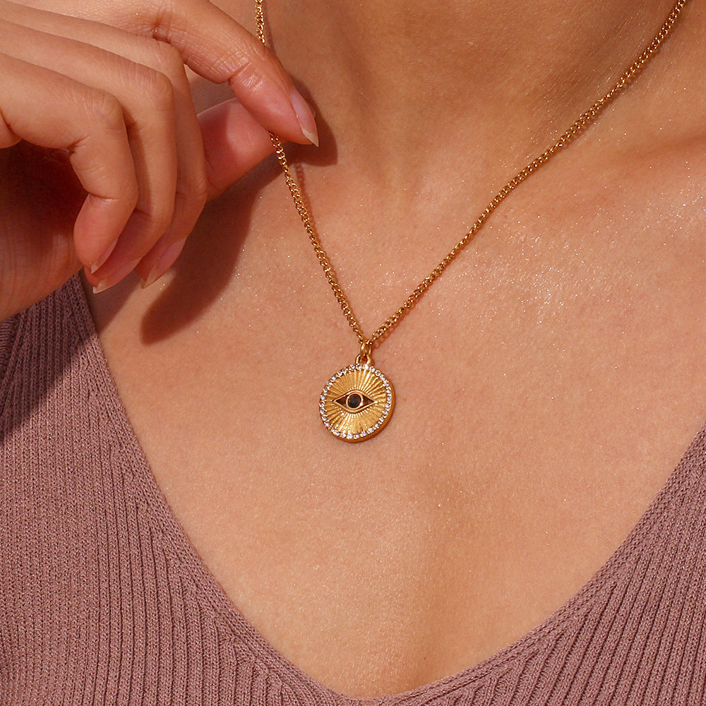 Minimalist Black Eye Pendant Necklace in Stainless Steel with 18K Gold Plating and Rhinestone Inlay, Sunburst Coin Shape