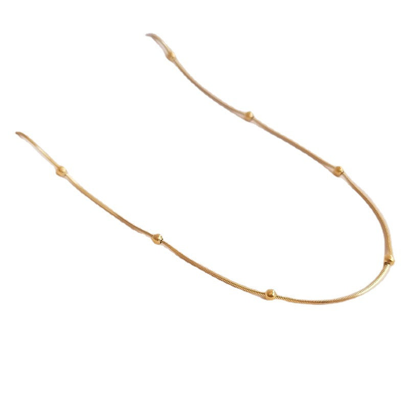 Elegante collana girocollo da donna a catena serpente in acciaio al titanio placcato oro 18 carati con perline geometriche