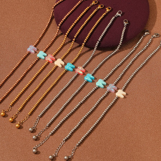 Pulsera de acero inoxidable con forma de diente de colores chapada en oro de 18 quilates para mujer