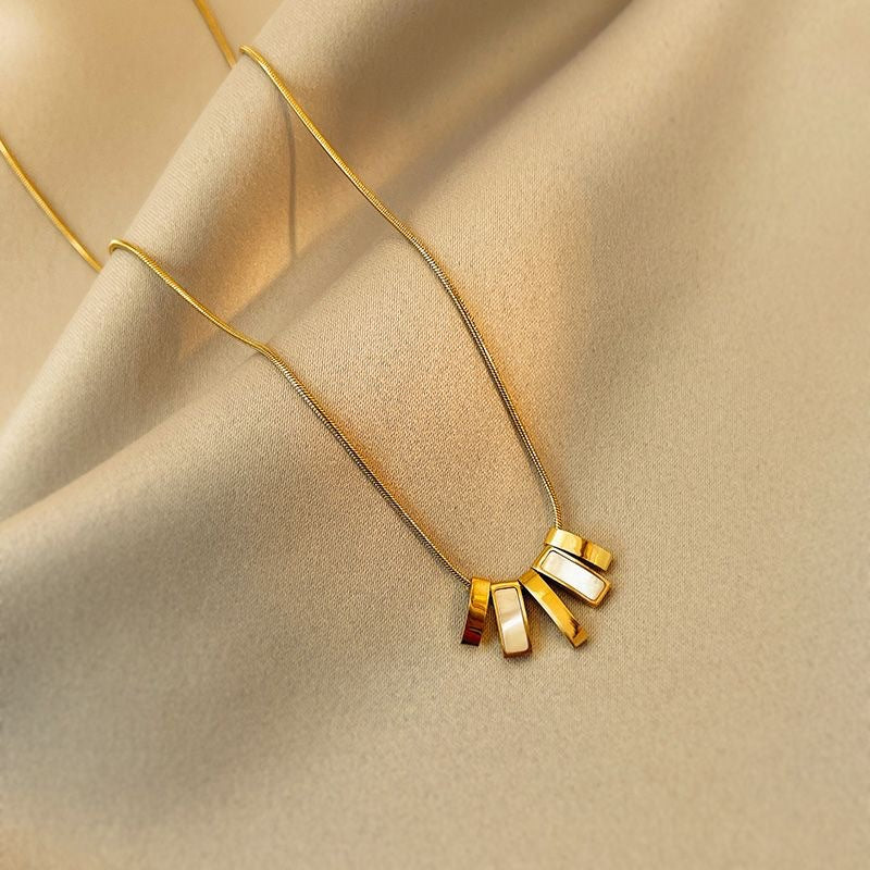 Minimalist Luxury Titanium Steel Plated Geometric Clover Pendant Necklace with Tassel for Unisex