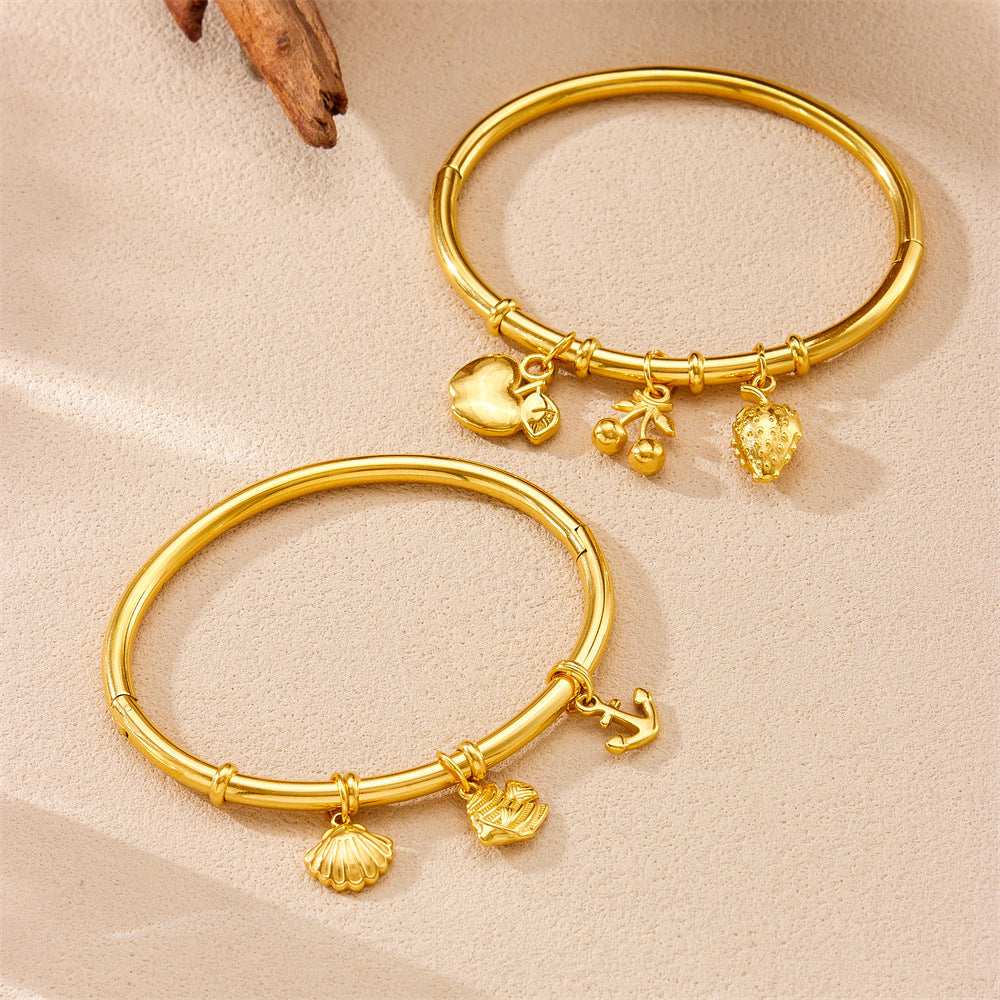 Bracciale Minimalista in Acciaio Inossidabile Placcato Oro a Tema Oceano Tropicale con Motivi di Stella Marina, Conchiglia e Farfalla