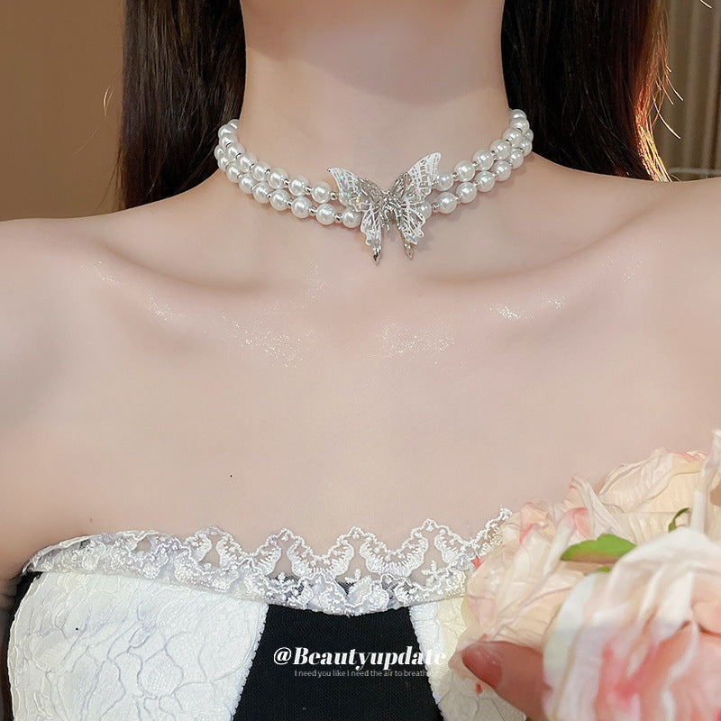 Elegante collar de mariposa de doble capa estilo francés con imitación de perla y colgante de cristal para mujer, cadena de clavícula