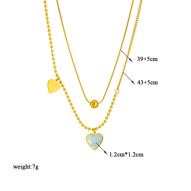 Collana pendente a cuore con conchiglia retrò francese minimalista in acciaio al titanio con finitura placcata per uno stile a strati