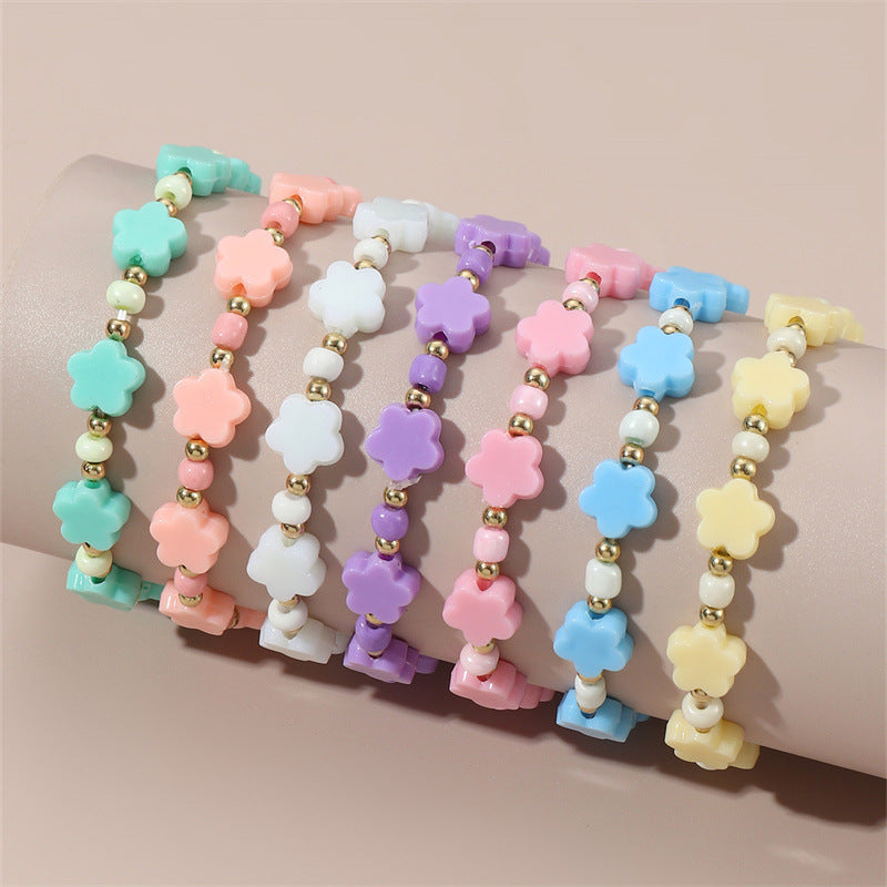 Braccialetto Minimalista a Stella con Perline per Bambini Realizzato in Plastica e Resina con Accenti Floreali Colorati
