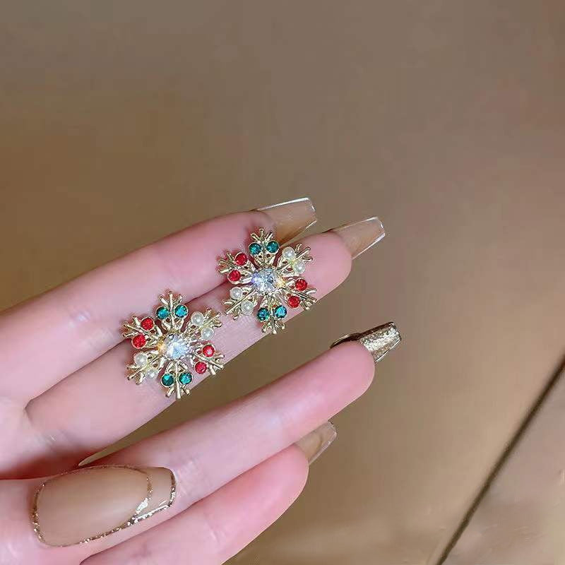 Pendientes de botón de aleación geométrica de copo de nieve de Navidad de moda para mujer con acabado chapado