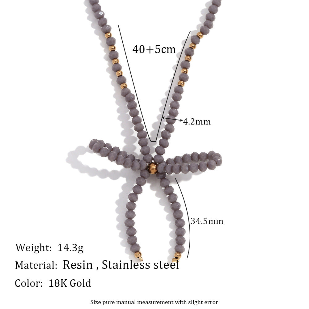 Collana con ciondolo minimalista a forma di fiocco in acciaio inossidabile con strass da donna