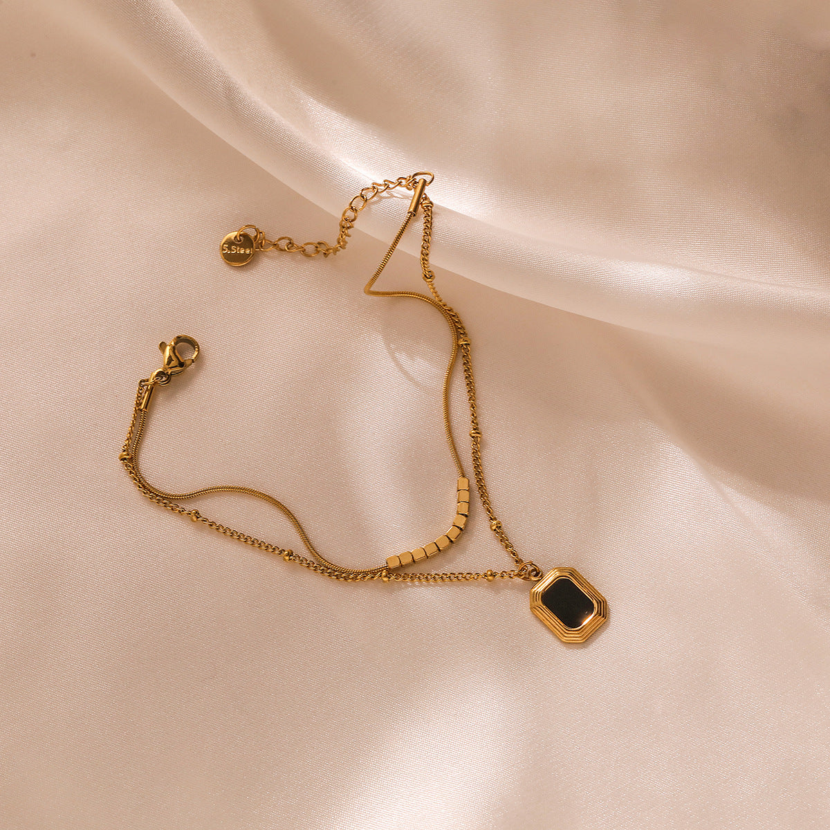 Bracciale da donna impilabile a doppio strato in acciaio al titanio con geometria minimalista e finitura placcata