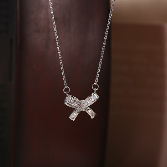 Collar minimalista con forma de lazo, chapado en acero titanio, con micro-circonitas incrustadas, para mujer y hombre