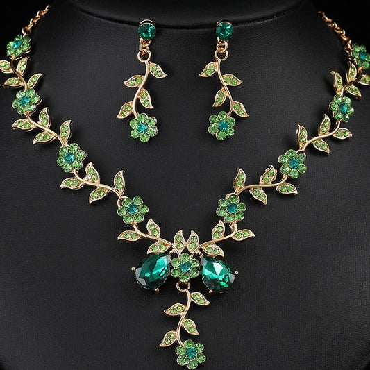 Juego de collar y pendientes de aleación floral vintage con acabado chapado en cadena O para mujer