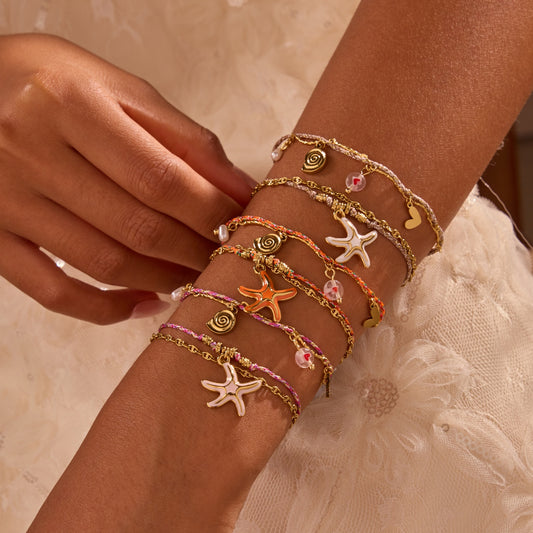 Elegante Pulsera de Acero Titanio Trenzada con Colgante de Estrella de Mar Temática Oceánica para Mujer con Diseño Geométrico y Acabado Chapado