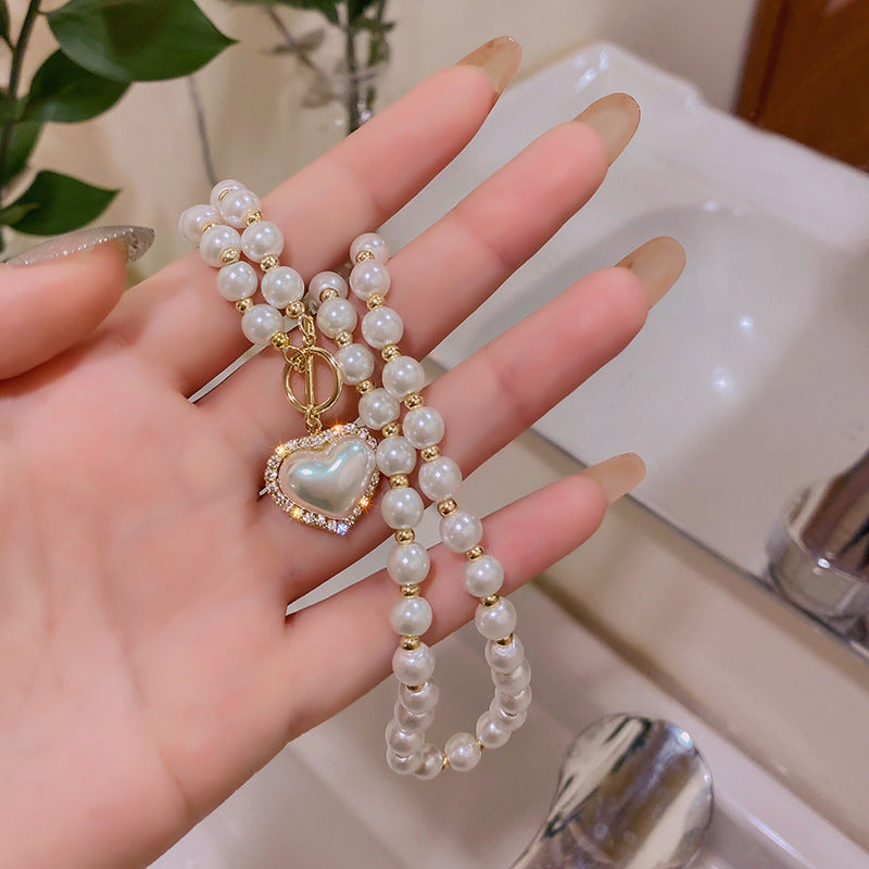 Chic Minimalist Heart-Shaped Pearl Necklace for Women with Alloy Chain and Electroplated Finish