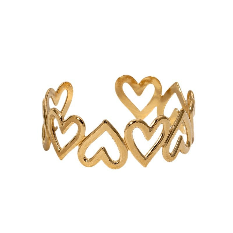 Bracciale rigido in acciaio inossidabile placcato oro a forma di cuore, minimalista e delicato, con finitura liscia e lucida