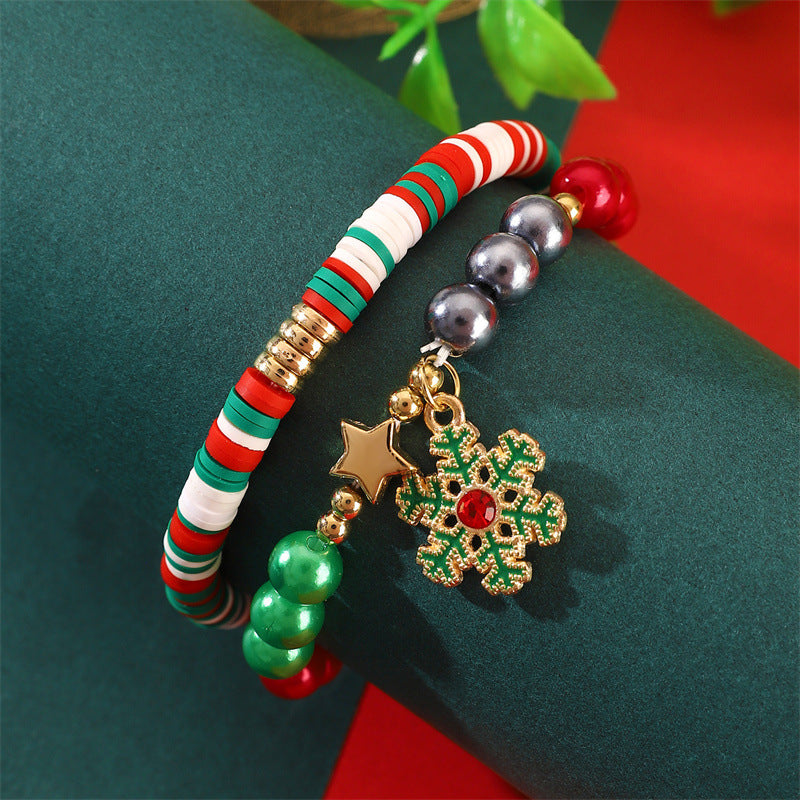 Set di bracciali natalizi fatti a mano in argilla polimerica da donna con ciondoli di Babbo Natale e fiocchi di neve in stile cartone animato giocoso