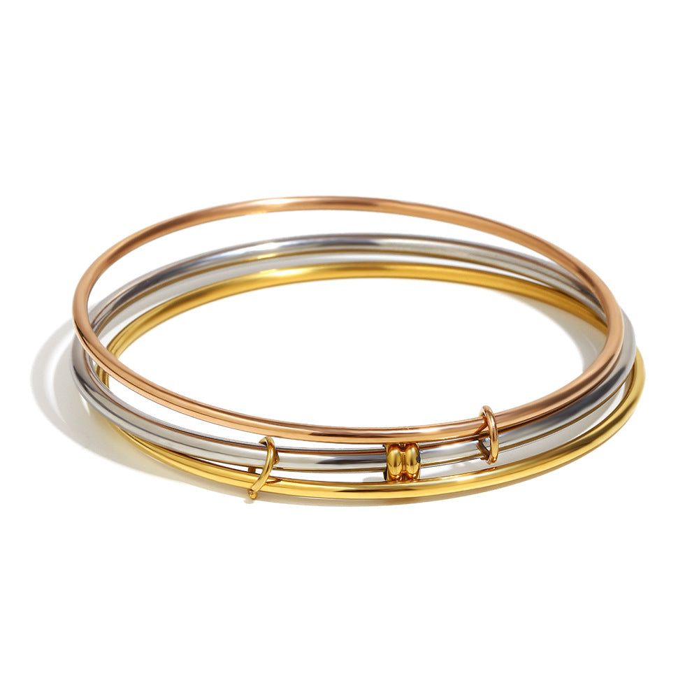 Pulsera Minimalista de Acero Inoxidable Enchapado en Oro de 18K con Tres Anillos de Colores Mezclados para Mujer