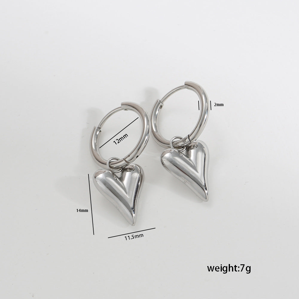 Pendientes minimalistas de corazón de acero inoxidable y titanio de contraste con baño de oro, acabado pulido, accesorio de moda versátil para mujer