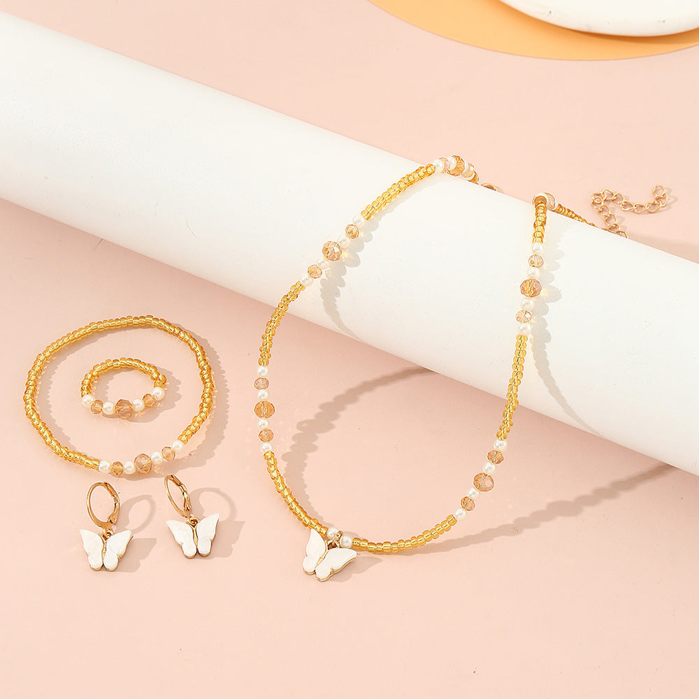 Set Collana Minimalista con Ciondoli a Farfalla e Cuore Smaltati per Bambini, Bracciale e Anello con Perline di Vetro, Catena a Sfere