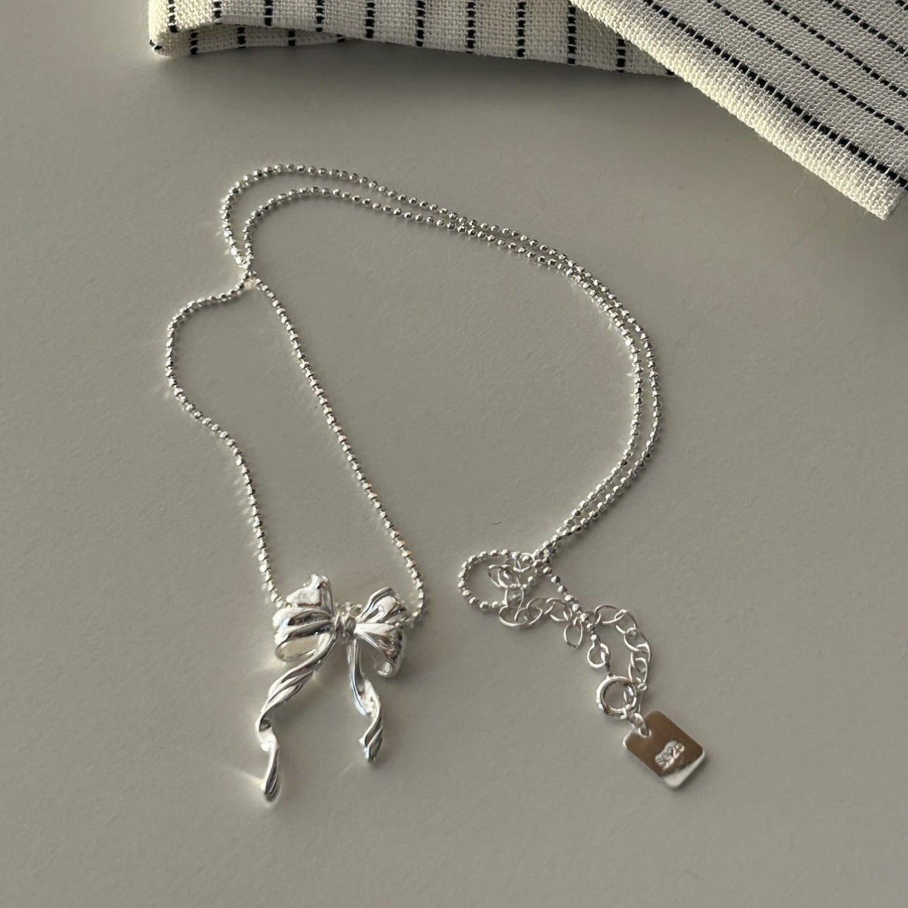 Minimalist Bowknot Necklace in 925 Sterling Silver with Geometric Shape and Rhodium Plating for Women