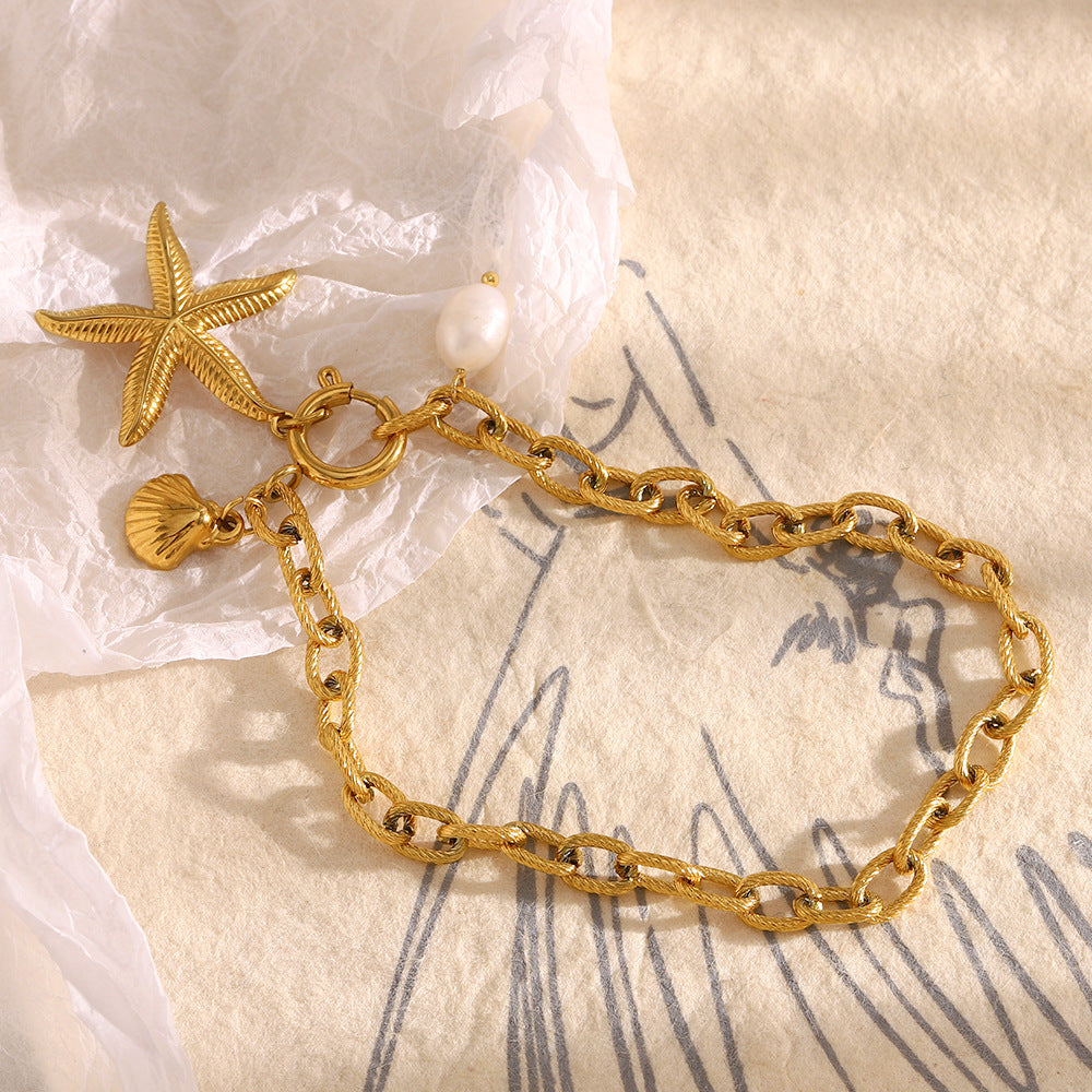 Cavigliera minimalista a forma di stella in acciaio inossidabile placcato oro 18 carati con accenti di perle da donna