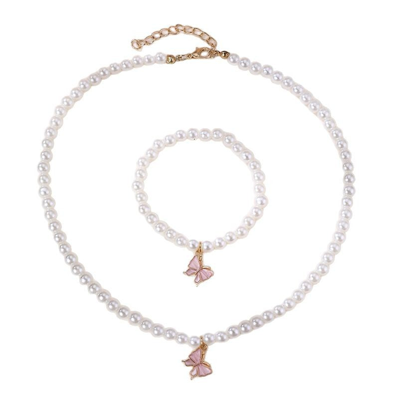 Conjunto Minimalista de Collar con Forma de Lazo de Aleación para Niñas con Detalles de Perlas, Incluye Pulsera, Anillo y Pendientes de Botón