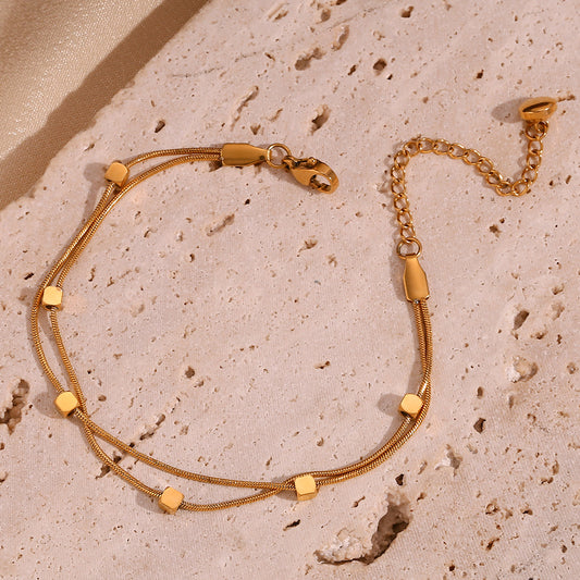 Pulsera de cadena de serpiente de doble capa chapada en oro de 18 quilates de acero inoxidable geométrico minimalista para mujer