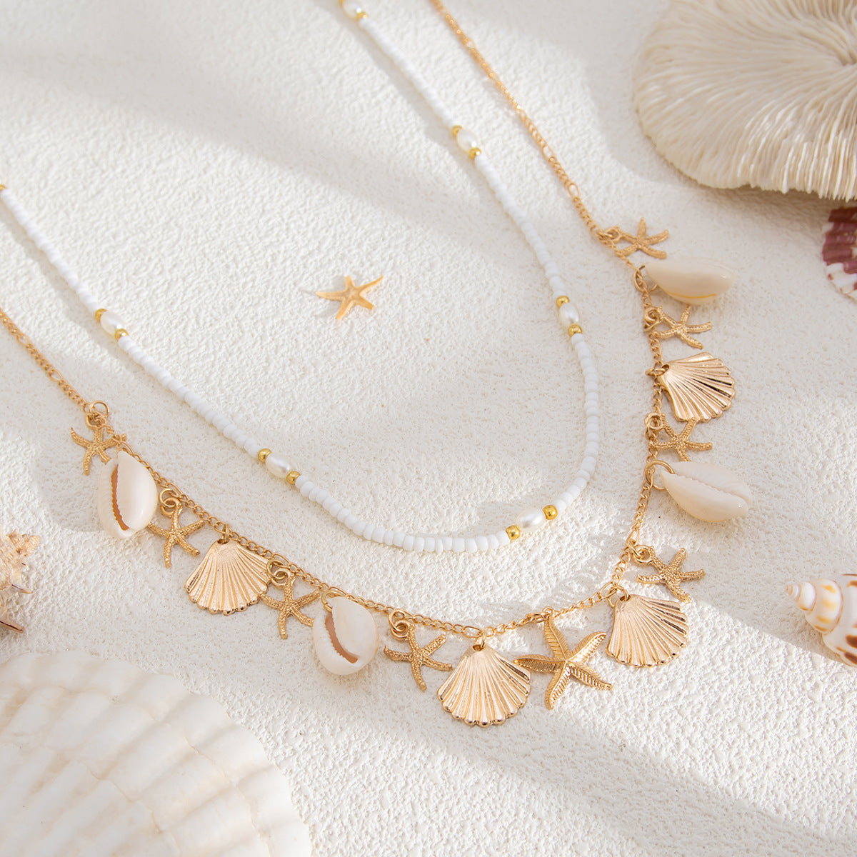 Catena in vita da donna stile boho con nappe e conchiglie, perline a forma di stella e ciondolo a ventaglio in abalone in metallo