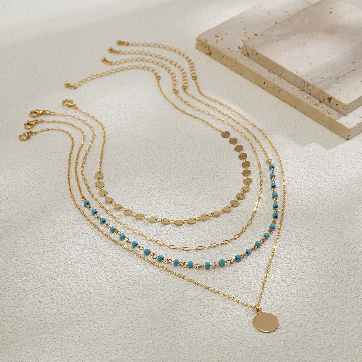 Collana Pendente Multistrato da Donna Fatta a Mano in Metallo Misto Stile Turchese Geometrico Minimalista con Frange e Catena Snake