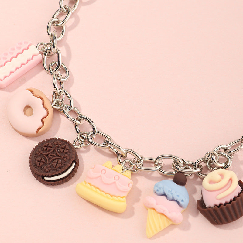 Pulsera de resina con colgante geométrico estilo punk para niñas, con cadena gruesa y borla.