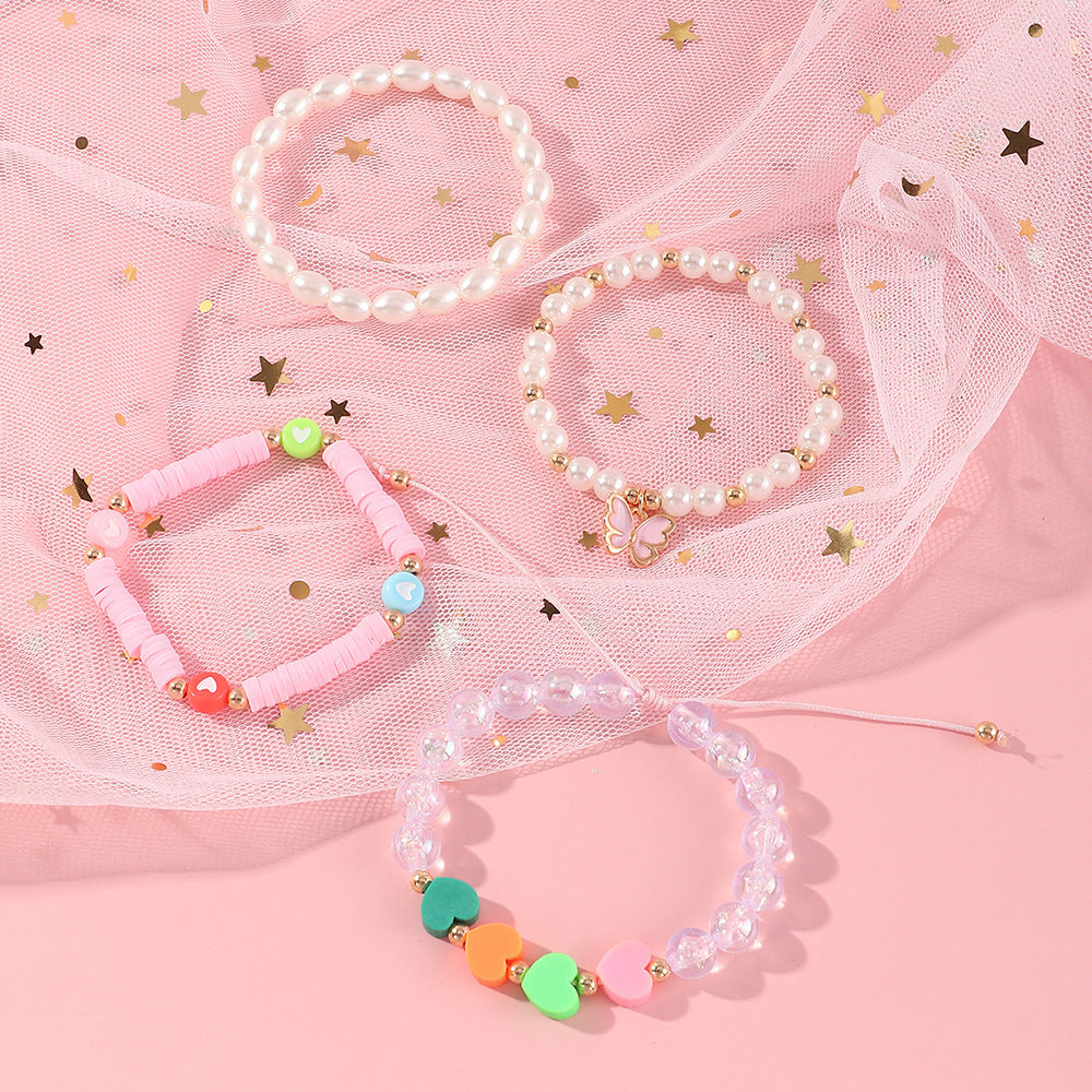 Pulsera de arcilla polimérica con mariposa y corazón esmaltados hechos a mano para niñas con detalles de perlas, bonito y versátil conjunto de joyas infantiles