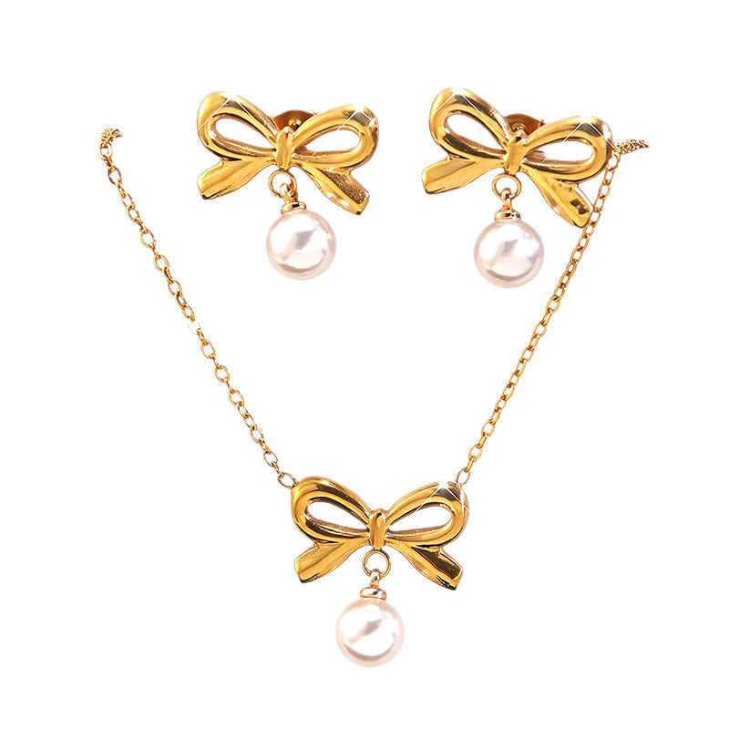 Elegante parure collana e orecchini in acciaio inossidabile con fiocco e perle, con catena a maglie forzatine