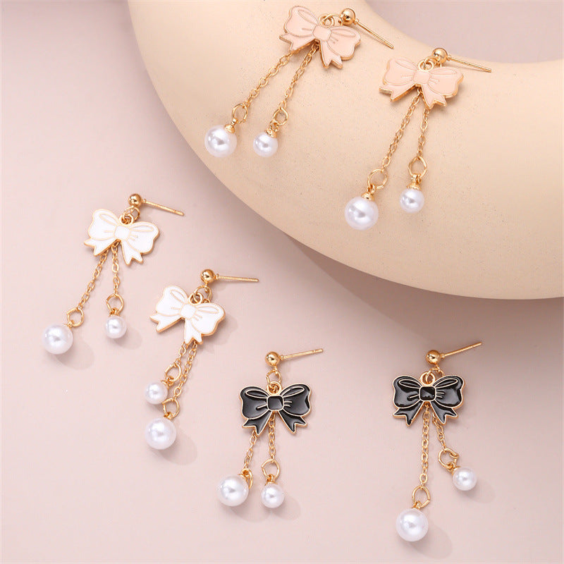 Bonitos aretes de aleación con borla de perlas y lazo de esmalte para niños