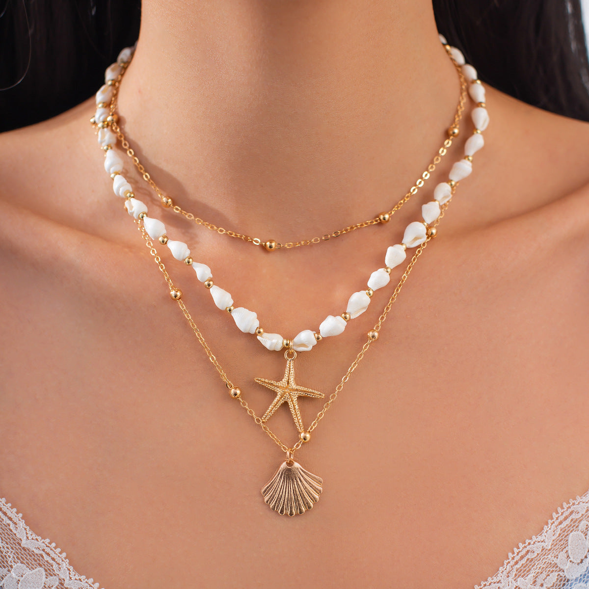 Collana con ciondolo a stella e fiore in stile vacanza per donna con perla finta, lega, finitura placcata, nappa e design geometrico su catena di perle