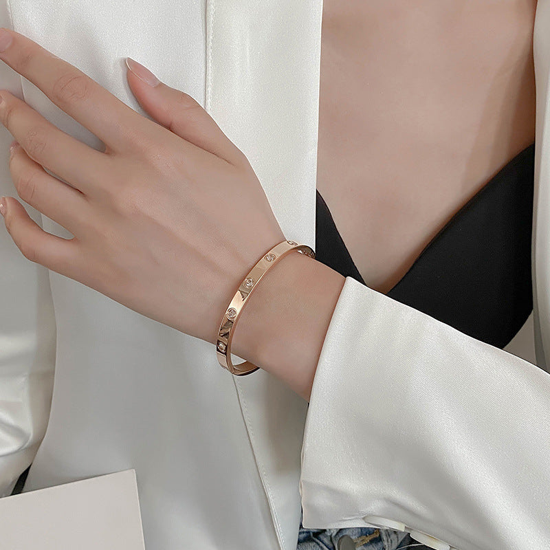Minimalist Titanium Steel Bracelet with 18K Gold Plating, Oval Geometric Design, Fade-Resistant Opening Bangle for Women