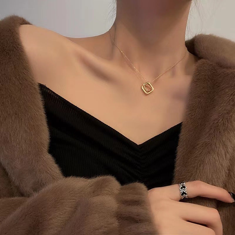 Minimalist Geometric Double Ring Pendant Necklace for Women in Titanium Steel with 18K Gold Plating and Micro-Pave Zirconia