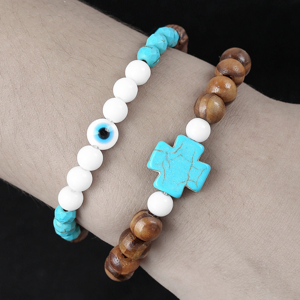 Bracciale Unisex con Perline Turchesi e in Porcellana, Perle in Legno e Ciondolo a Croce Geometrica