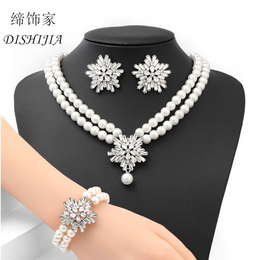 Conjunto de colgante de copo de nieve de diseño original con collar de perlas de imitación, pendientes de diamantes de imitación y pulsera de perlas para mujer