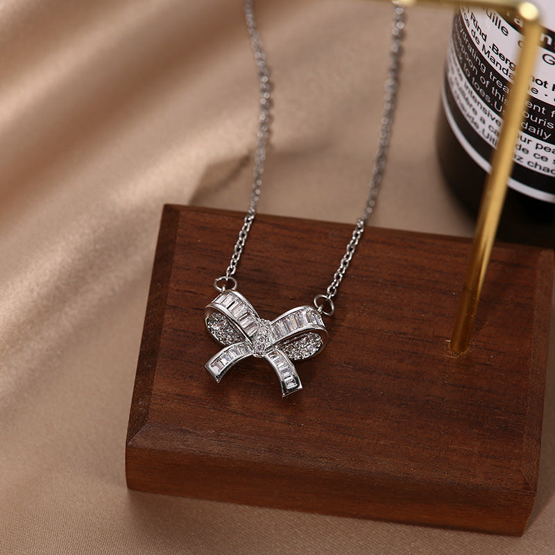 Minimalist Bow-Shaped Titanium Steel Plated Clavicle Necklace with Micro-Pave Zirconia for Women and Men