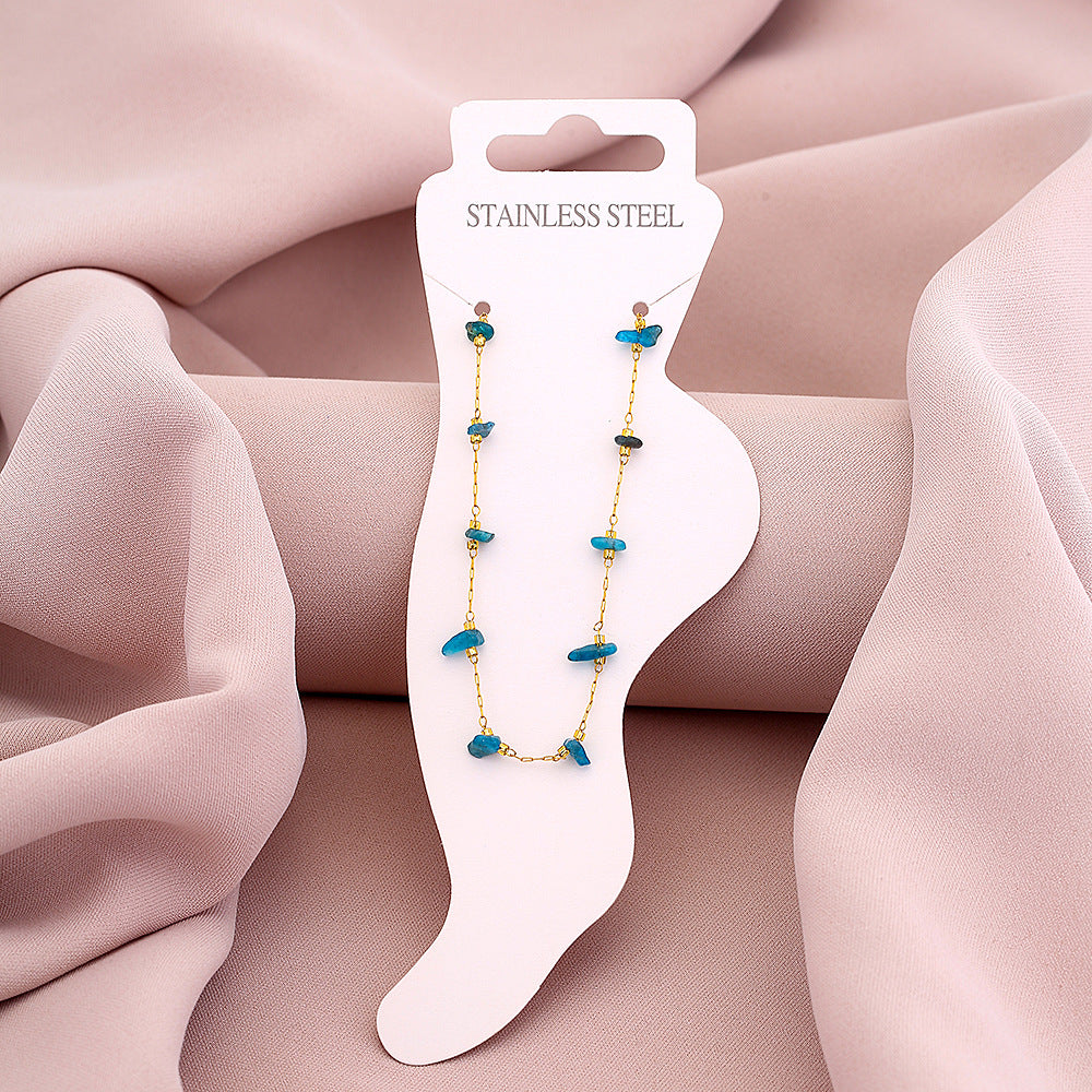 Elegante tobillera geométrica de acero de titanio para mujer con acento de piedra natural en azul pavo real