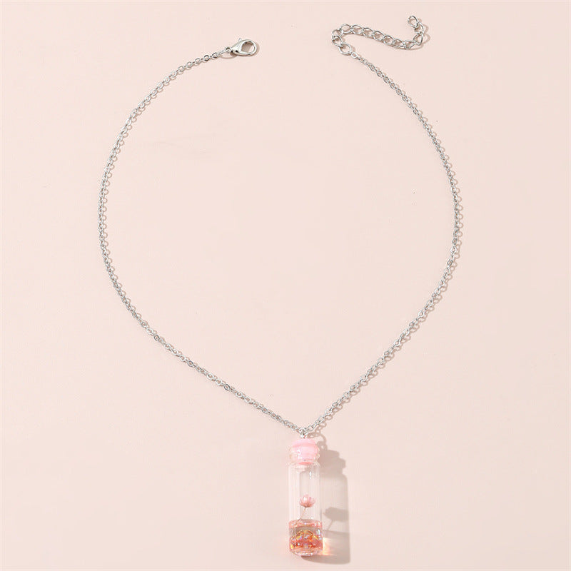 Collar con colgante de cristal geométrico minimalista para niños con flores secas rosas y encapsulación de resina