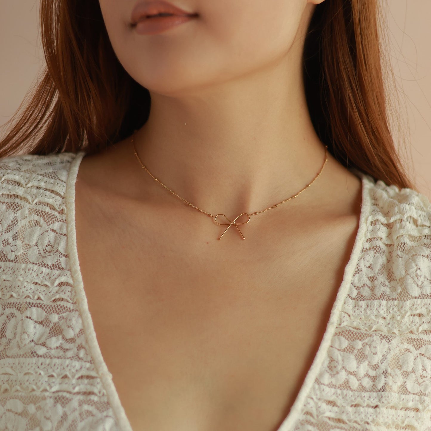 Parure Collana e Bracciale da Donna con Fiocco in Acciaio al Titanio Placcato Oro 18K