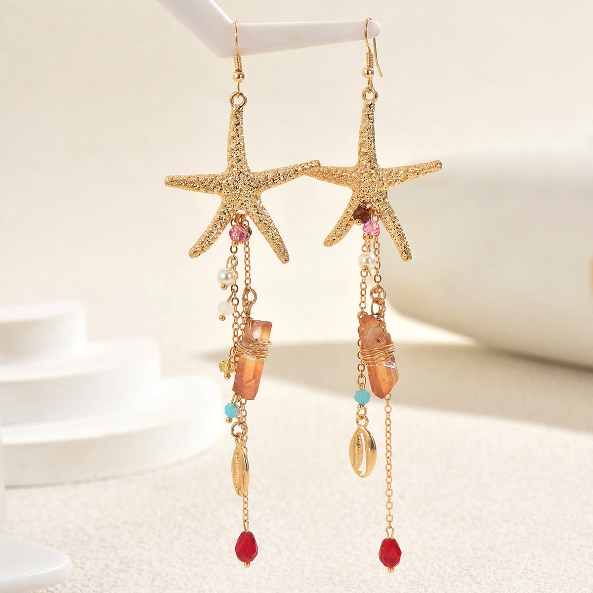 Pendientes largos de aleación de zinc con forma de estrella, elegantes, con incrustaciones de diamantes de imitación y detalles de concha para mujer