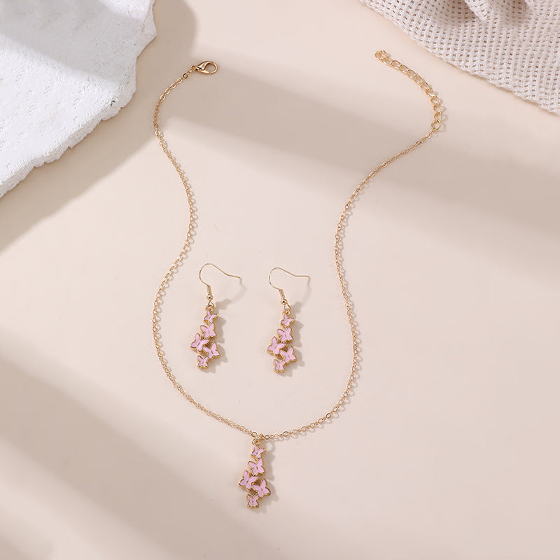 Conjunto de collar con colgante de lazo y mariposa minimalista con acabado esmaltado para niños, joyas de resina en cadena de cuentas