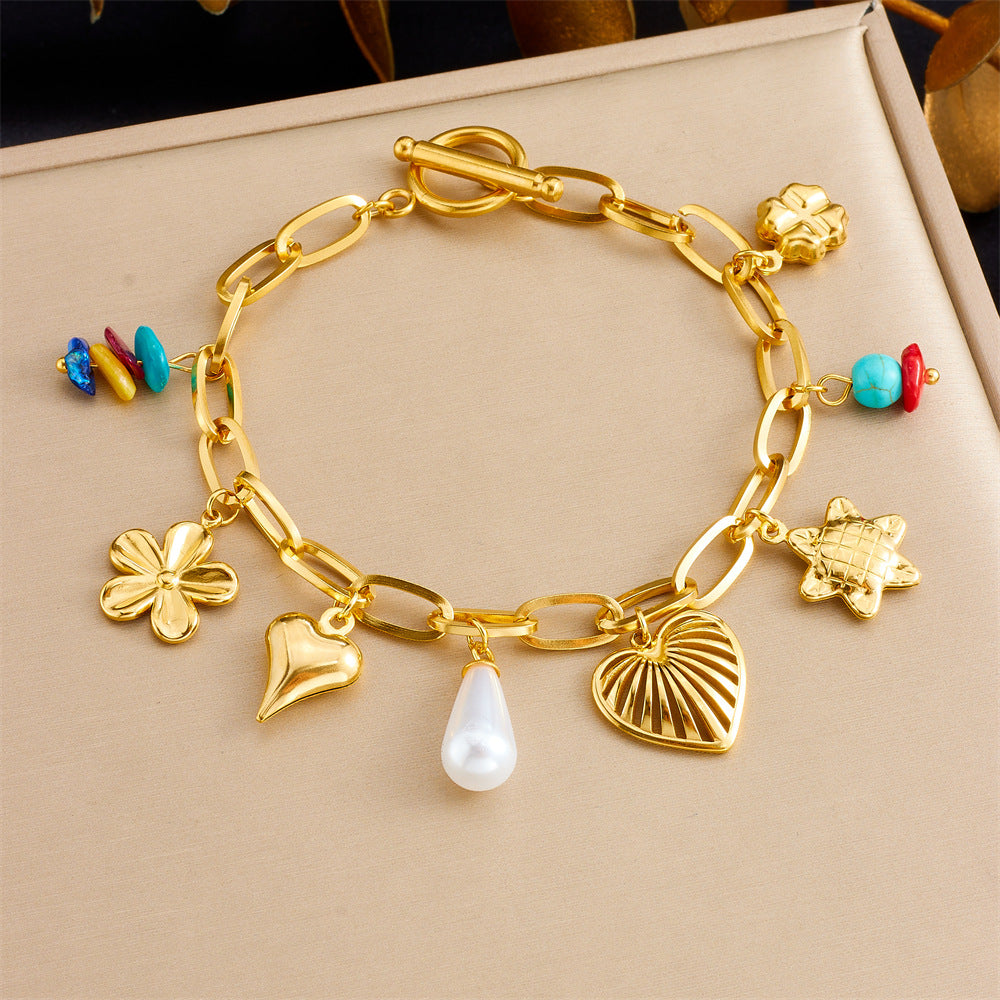Bracciale con ciondolo floreale e a cuore in stile vintage in acciaio inossidabile con finitura placcata da donna