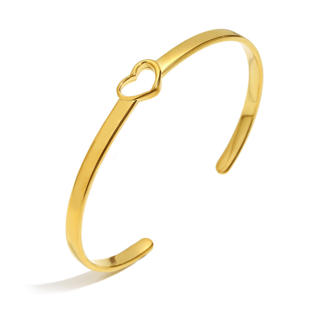 Pulsera de acero inoxidable con corazón hueco de estilo francés minimalista, chapado en oro de 18 quilates y líneas de acento de circonita
