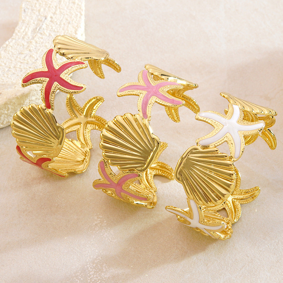 Bracciale a polsino in acciaio inossidabile con gocciolamento casuale, stella marina e conchiglia