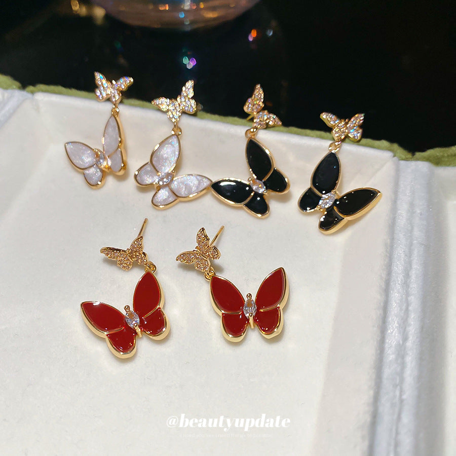Elegantes pendientes de tuerca con forma de mariposa de estilo francés para mujer con base de cobre chapado, incrustaciones de diamantes de imitación y acabado esmaltado